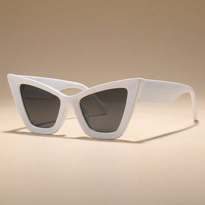 Stylish women's vintage oversized cat eye sunglasses, UV400 protected fashion eyewear accessory.
