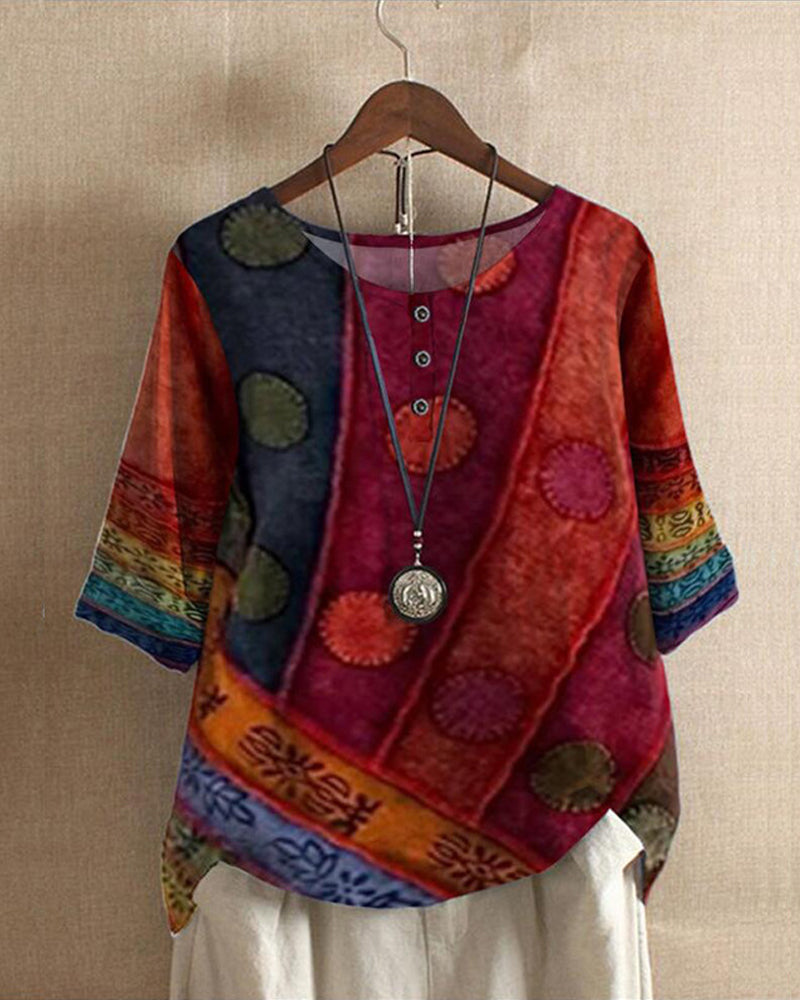 Women's vintage patchwork print tunic blouse with a relaxed fit, perfect for casual wear. Features a round neck.