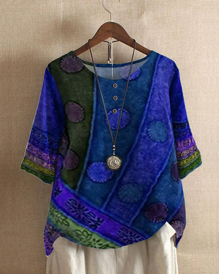 Printed women's tunic blouse, vintage patchwork design, round neck, and three-quarter sleeves. Great for autumn.