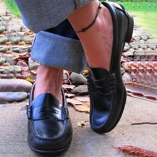 Women's vintage slip-on loafers with a low heel, offering effortless style and comfort for everyday wear.