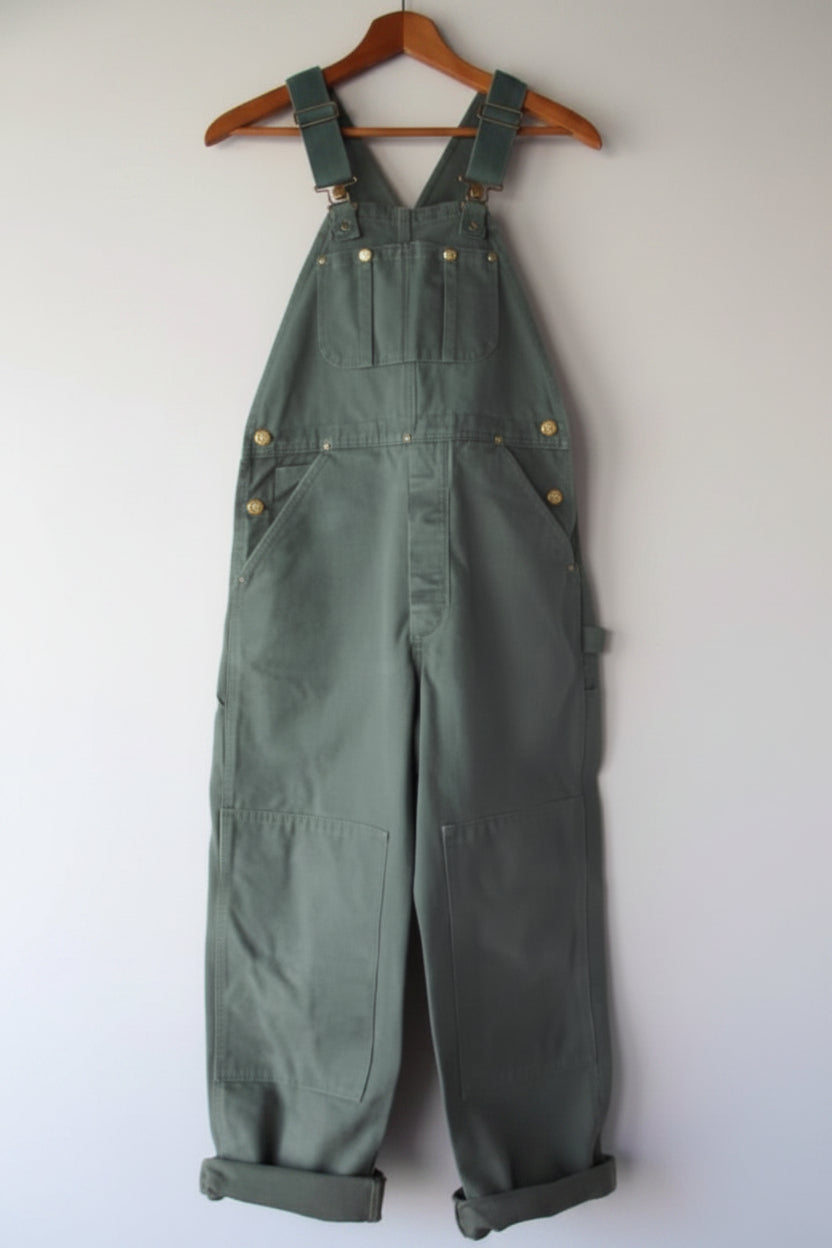 Close-up of women's vintage bib overalls showcasing adjustable straps and classic bib design.