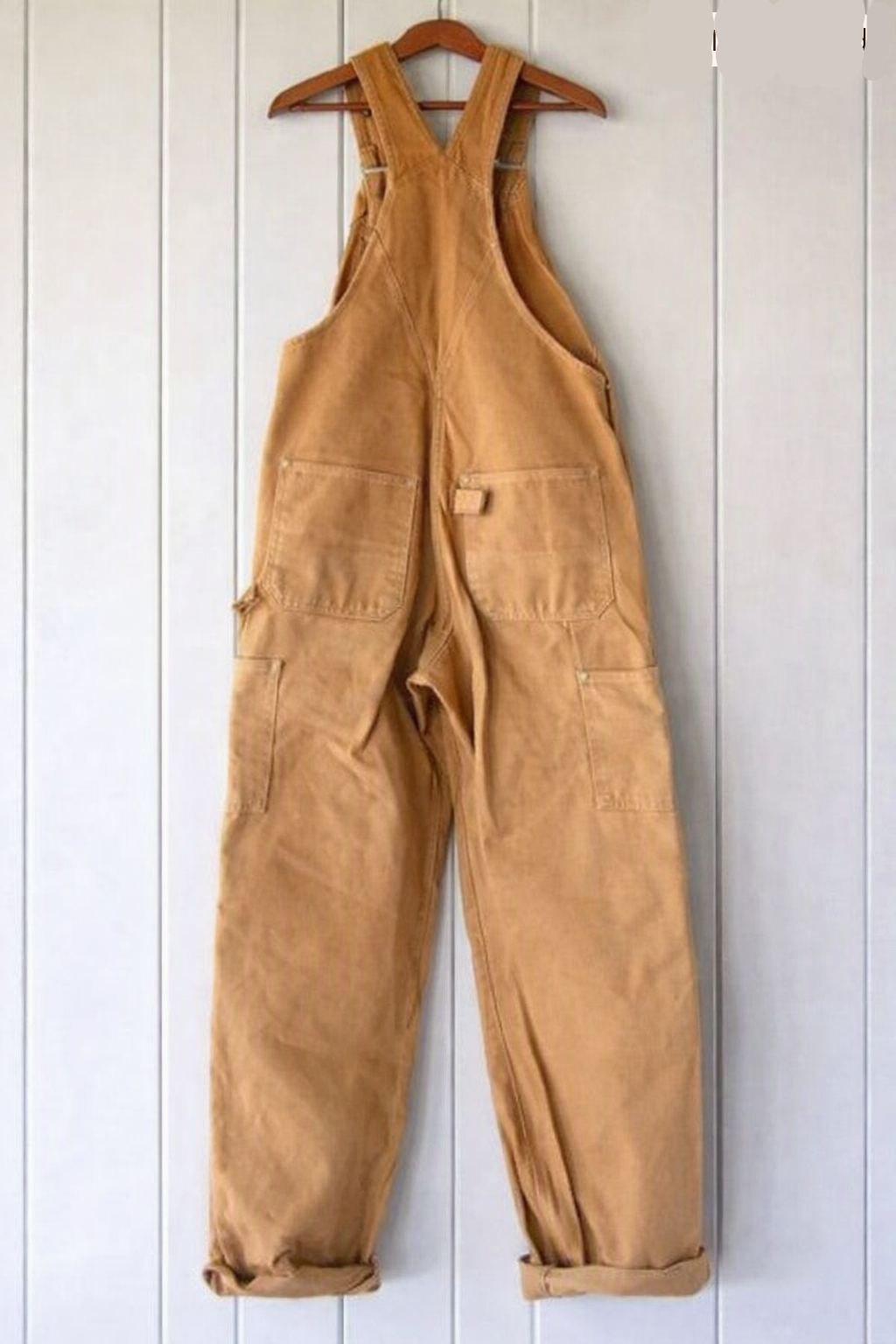 Textured fabric of women's vintage-style bib overalls, durable and comfortable for daily wear.