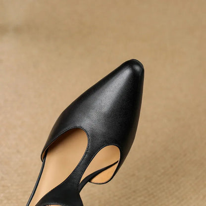 Back view of women's classic T-Strap mid-heel pumps, showcasing elegant vintage-inspired design.