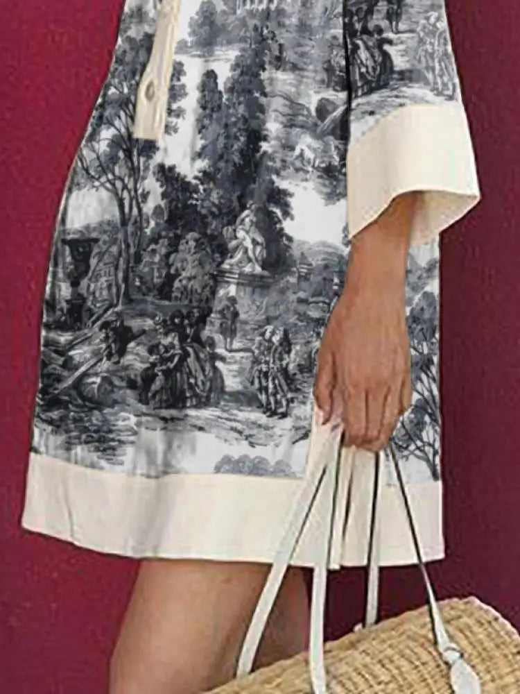 Model wears a relaxed fit women's vintage toile print mini tunic dress. Ideal for chic summer casual wear.