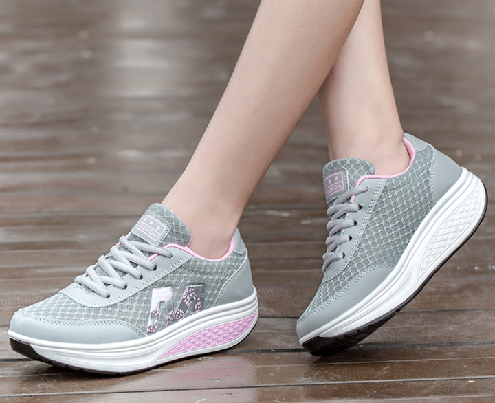 Breathable women's walking sneakers with superior arch support and lightweight construction for comfortable daily walks.