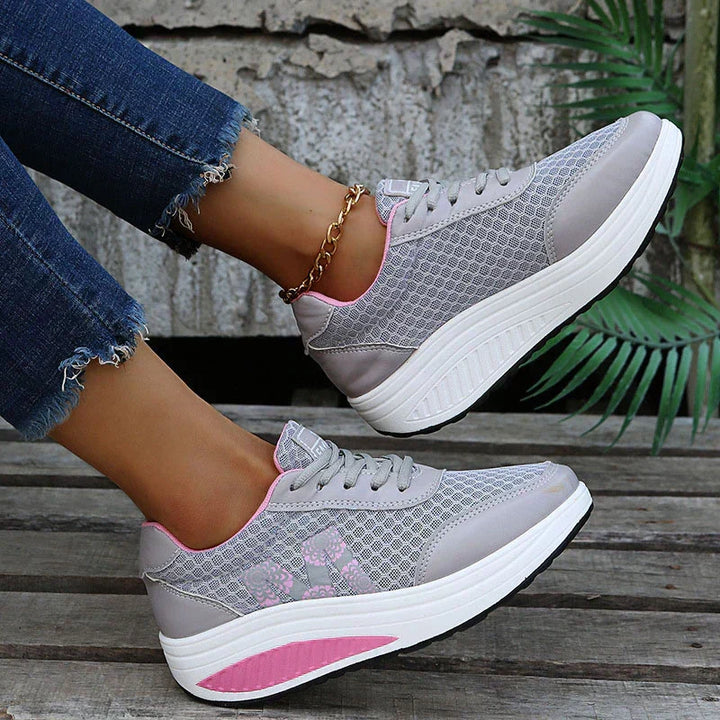 Modern women's walking sneakers with breathable mesh, supportive comfort, ideal lightweight footwear for daily activity.
