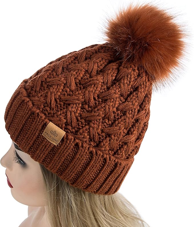 Quality women's warm winter hat: durable cable knit, soft fleece lining, stylish pom-pom.
