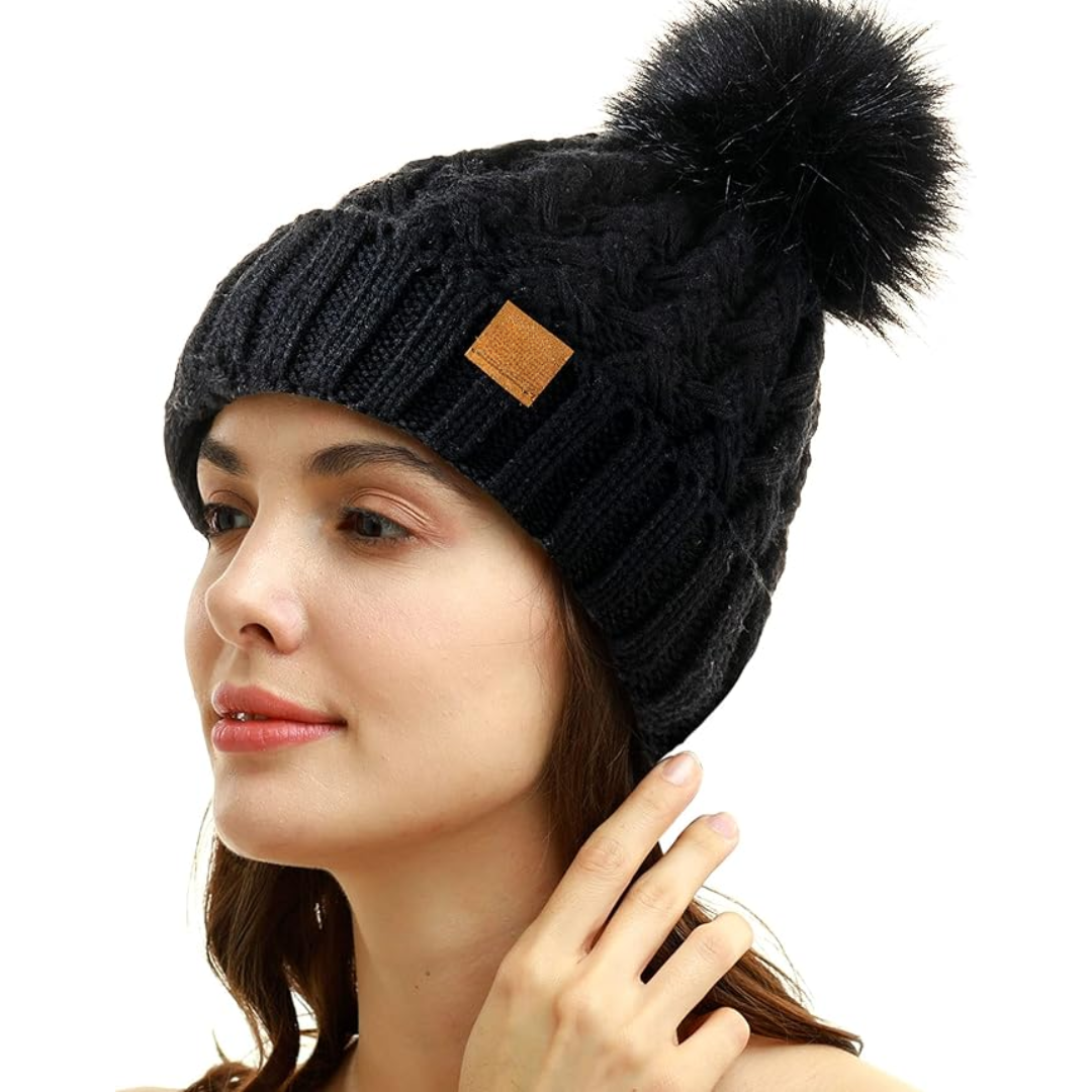 Stylish women's winter beanie: warm cable knit design, fleece-lined, with a classic pom-pom.