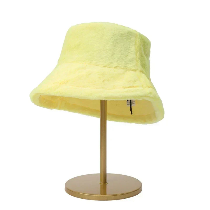 Cozy and fashionable women's faux rabbit fur bucket hat. Perfect for winter warmth and chic style.