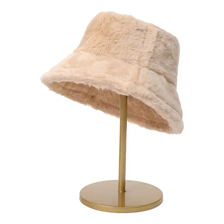 Plush faux rabbit fur bucket hat for women, offering luxurious warmth and elegant winter style.