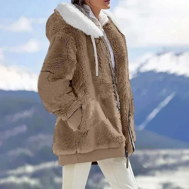 Insulated women's hooded winter coat, offering cozy warmth and stylish outerwear for cold.