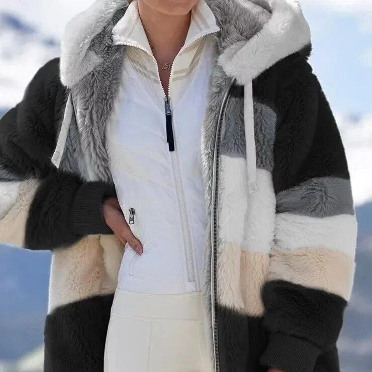 Fashionable women's winter jacket with hood, offering warmth & protection from cold.