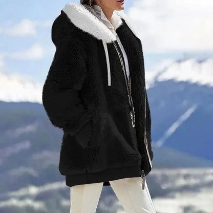 Durable women's hooded outerwear, a stylish and warm jacket for winter adventures.