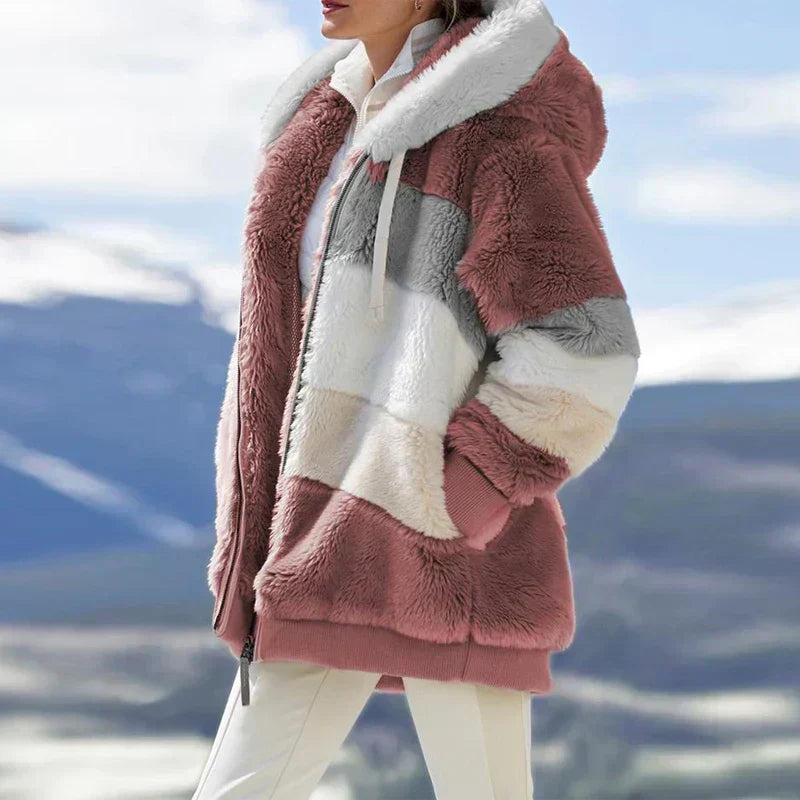 Essential women's hooded winter jacket, keeping you warm & stylish all season long.