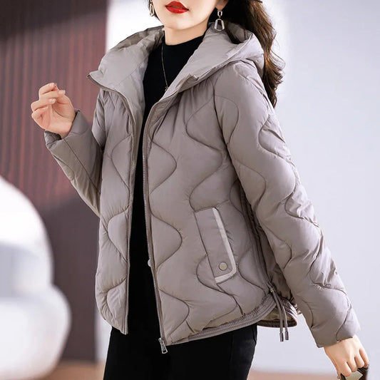Women's warm quilted puffer jacket. Chic winter outerwear for everyday casual style & comfort.