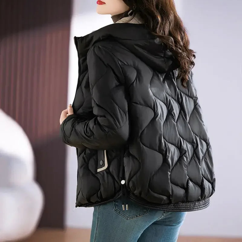 Modern women's quilted puffer jacket. Stylish, warm, and insulated for contemporary winter fashion.