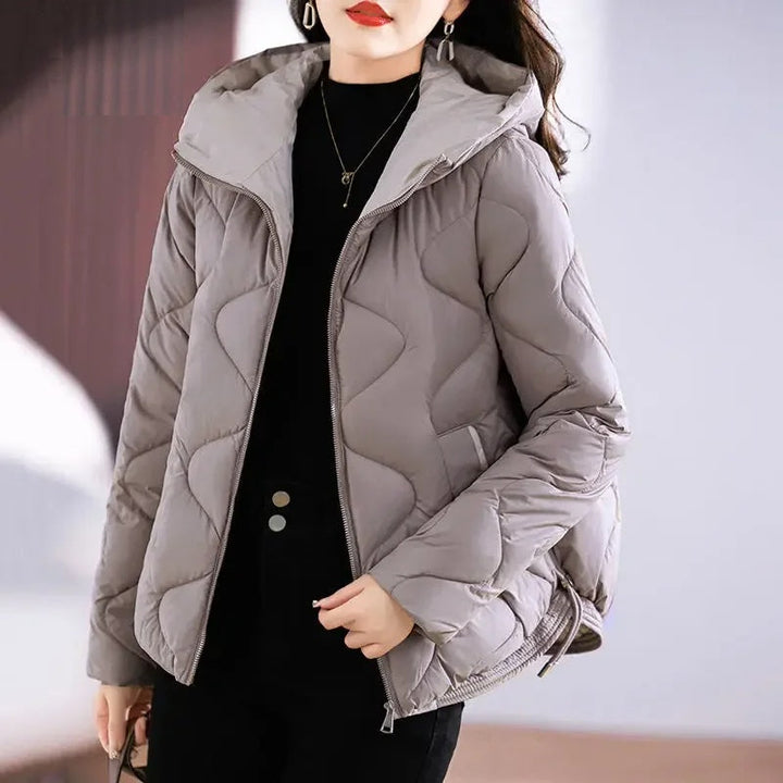 Stylish women's quilted puffer jacket. Fashion-forward and insulated for cold winter days.
