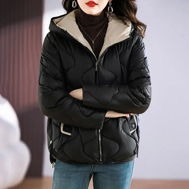 Women's warm winter puffer jacket. Chic quilted outerwear for cold weather and stylish fashion.