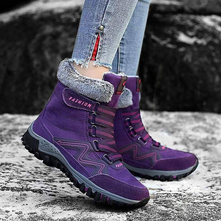 Durable women's snow boots in suede leather, designed for warmth and outdoor adventures