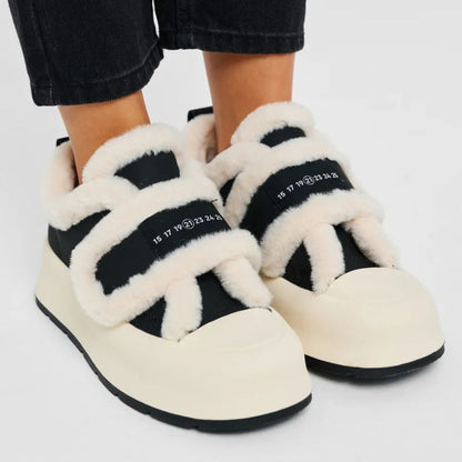 Women's warm winter slip-on shoes for cozy comfort & casual style.