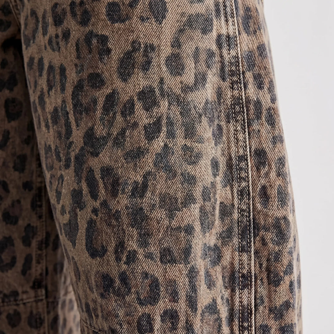 Ankle-length women's barrel jeans featuring a unique washed leopard pattern and comfortable relaxed fit.
