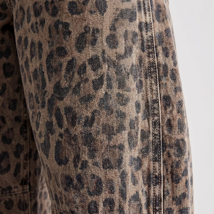 Ankle-length women's barrel jeans featuring a unique washed leopard pattern and comfortable relaxed fit.