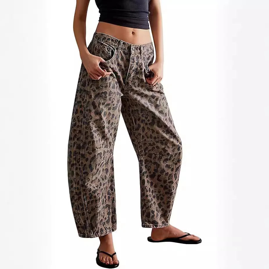 Fashionable women's mid-rise barrel jeans with a stylish washed leopard print, ideal for a statement streetwear look.
