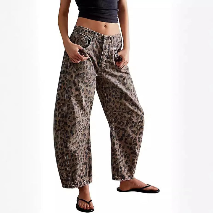 Fashionable women's mid-rise barrel jeans with a stylish washed leopard print, ideal for a statement streetwear look.