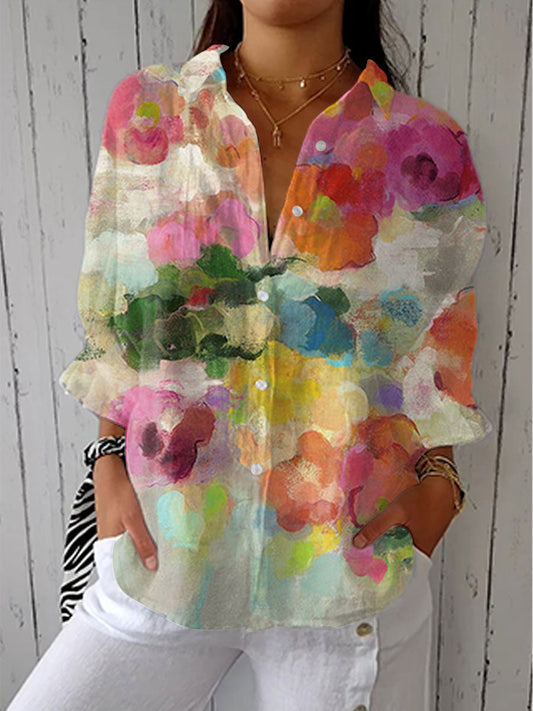 Women's Watercolor Dreams Blouse with vibrant artistic floral print, perfect for chic summer style.