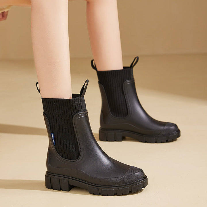 Stylish women's rain boots, perfect for all-weather outdoor adventures and casual wear.