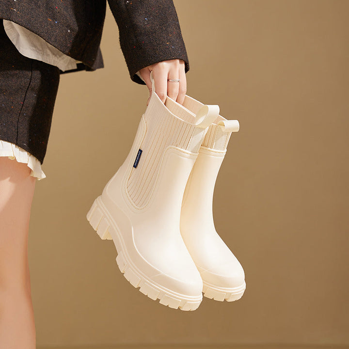 Durable & comfortable women's waterproof boots with slip-resistant sole for wet conditions.