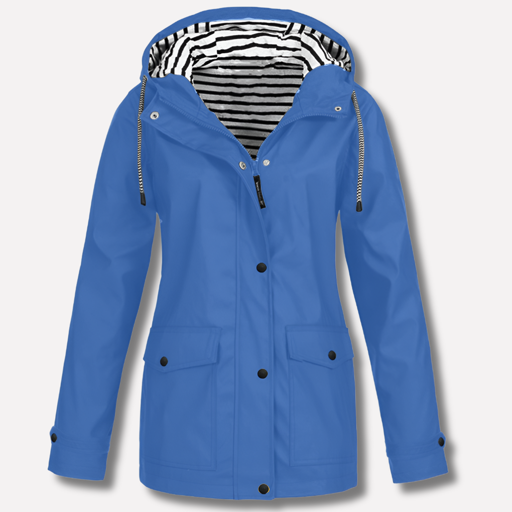 Lightweight women's travel raincoat, a waterproof hooded jacket for reliable all-weather protection.