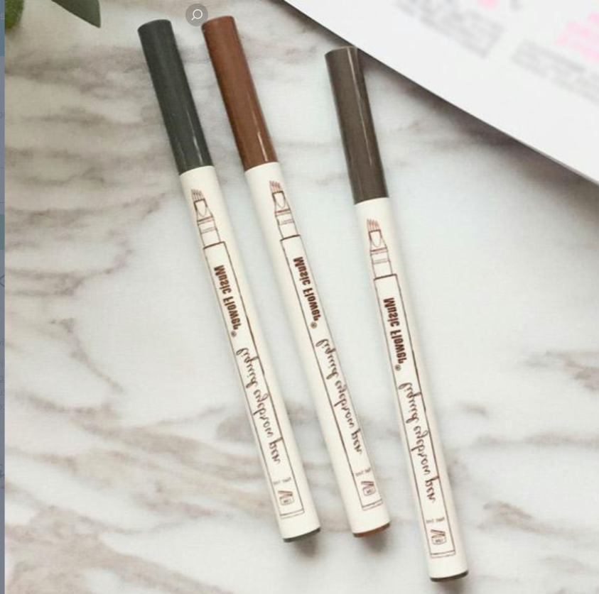 Close-up of a microblading eyebrow pen creating natural-looking, hair-like strokes for perfect brows.