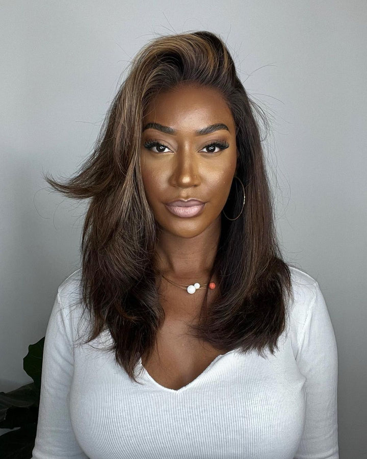 Wavy human hair lace front wig for women, dark brown with blonde highlights, premium quality.