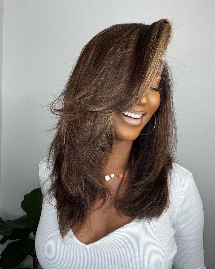 Elegant women's wavy human hair lace front wig, dark brown base with blonde highlights for a chic look.