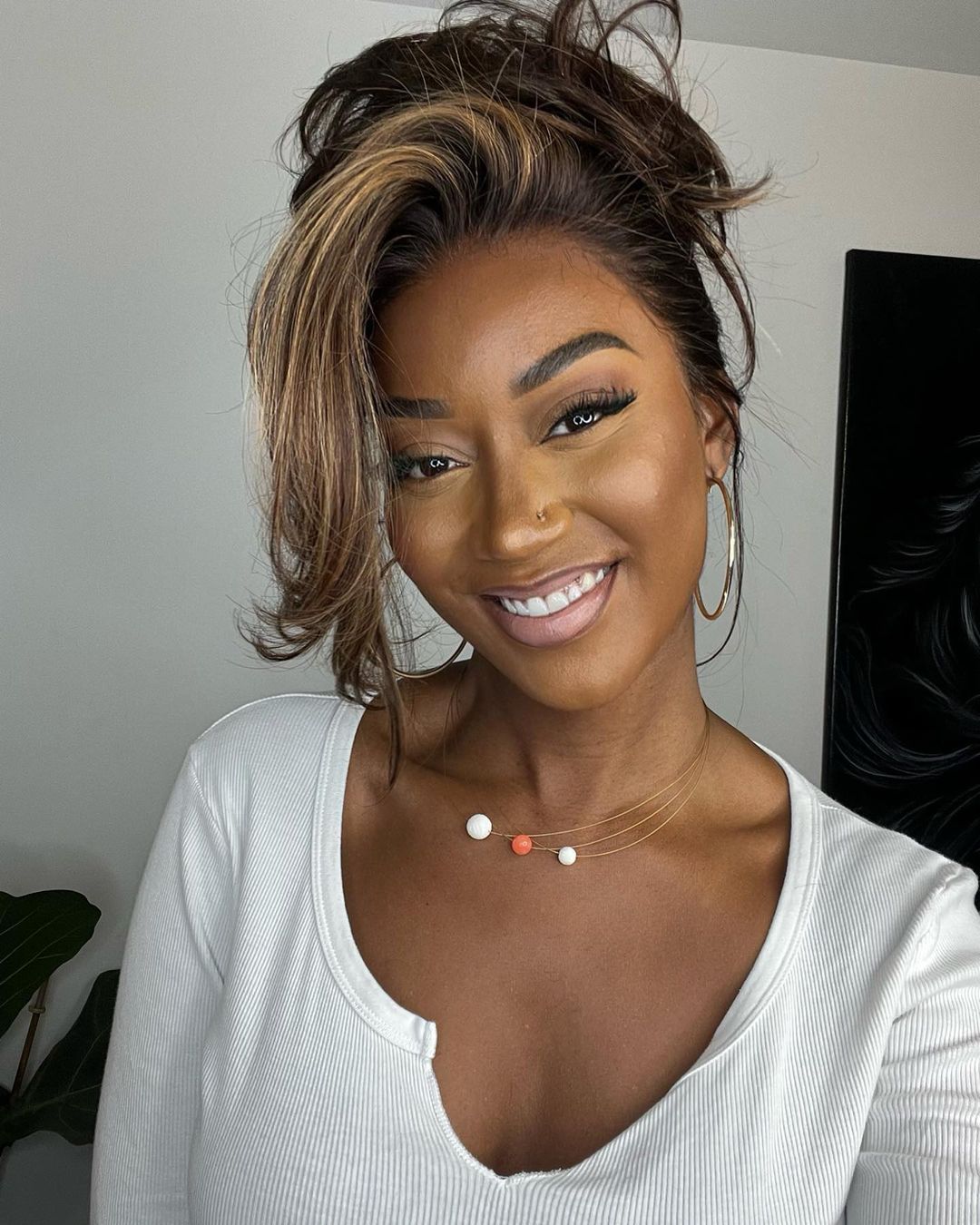Swiss lace front wig: women's wavy human hair, rich dark brown with striking blonde highlights.