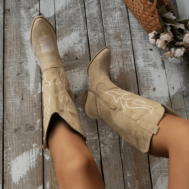 Women's Western cowboy boots with side zipper, pointed toe, embroidered details, and a comfortable block heel.
