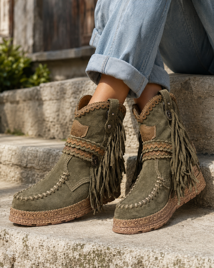 Boho chic women's ankle boots with western fringe, round toe, and flat soles. Great for casual footwear.