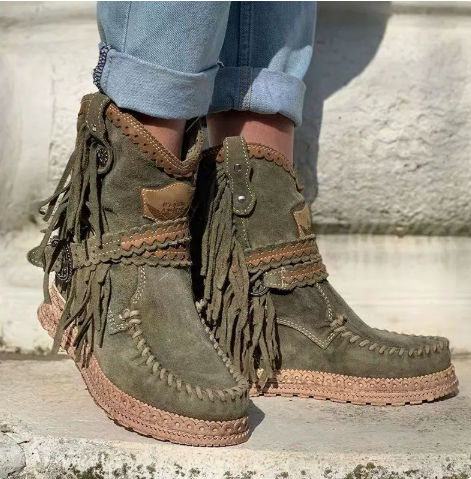 Slip-on women's western fringed ankle boots. Comfortable, stylish for boho and festival fashion.