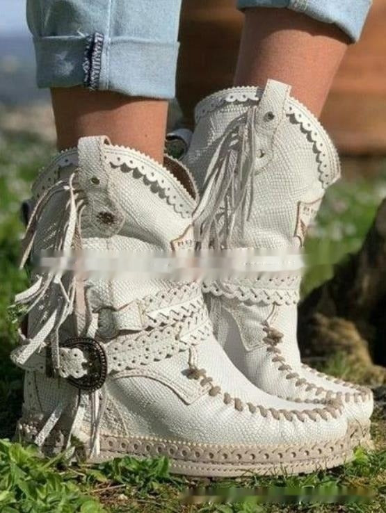 Casual women's western ankle boots with playful fringe. Embrace bohemian chic for everyday comfort.
