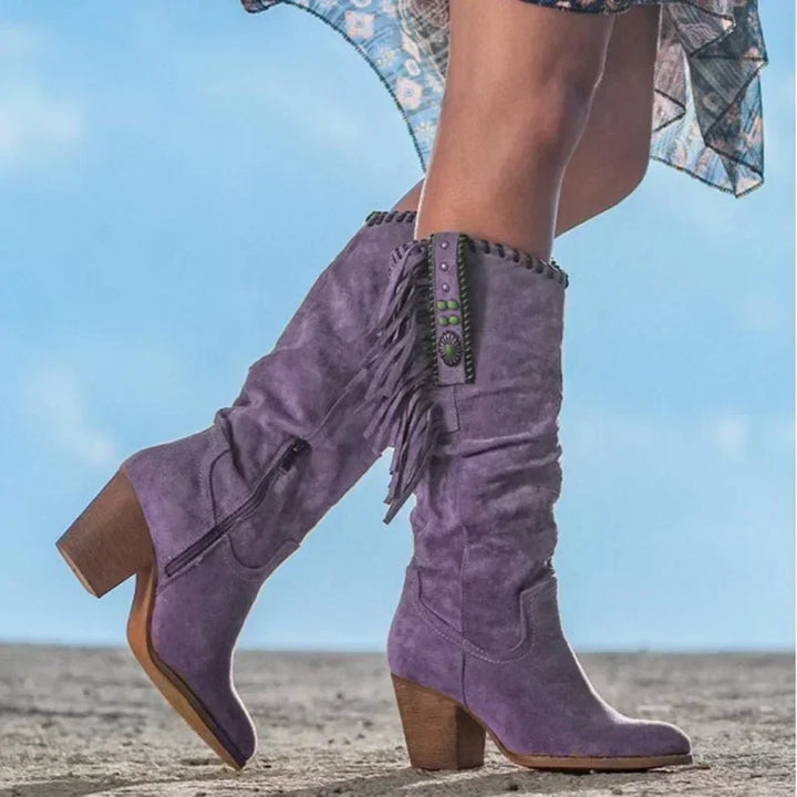 Stylish women's Western boots: mid-calf design, turquoise studs, fringe detailing, and a comfortable block heel.