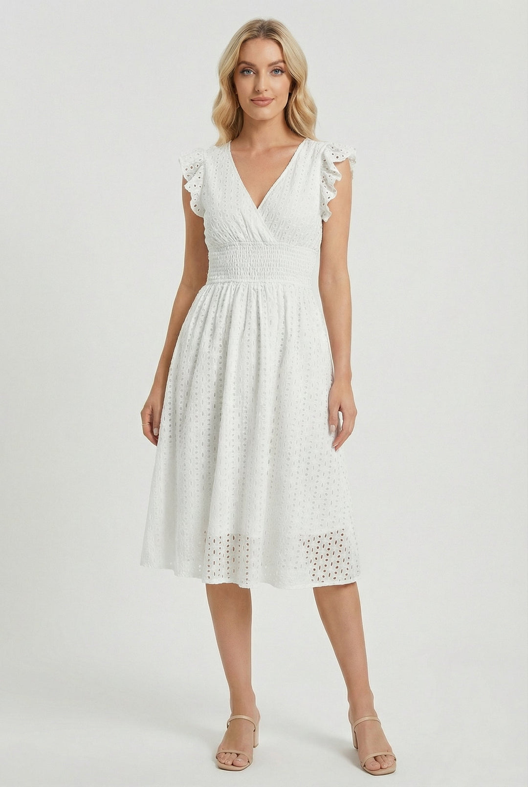 Women's white eyelet midi dress with ruffled sleeves & smocked waist. Flared for summer elegance & comfort.