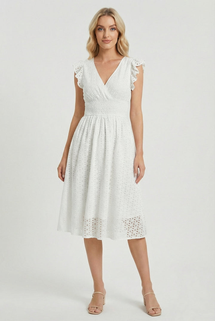 Women's white eyelet midi dress with ruffled sleeves & smocked waist. Flared for summer elegance & comfort.