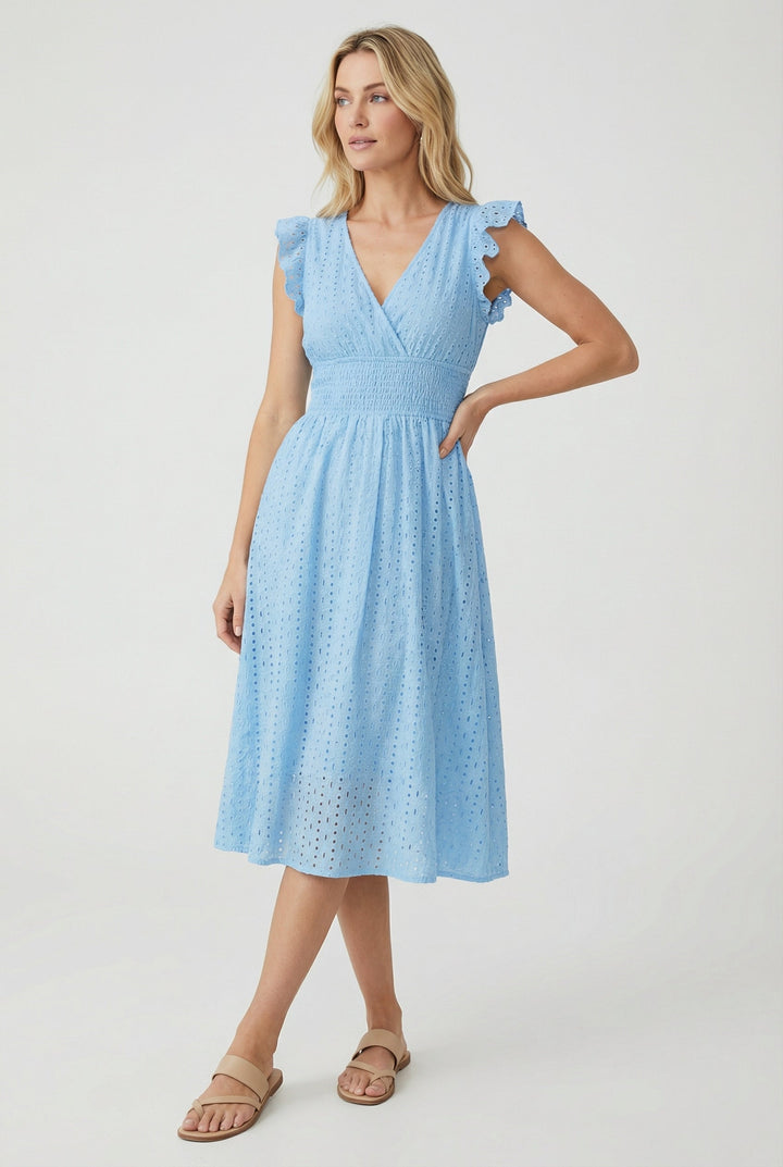 Flat lay: Women's white eyelet midi dress with ruffled sleeves, smocked waist, and flared hem. Casual summer fashion.