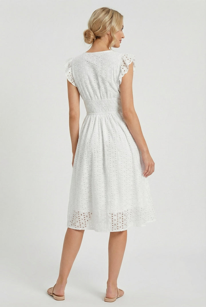 Back view: Women's elegant flared eyelet midi dress with ruffled sleeves & smocked waist. Perfect casual summer wear.