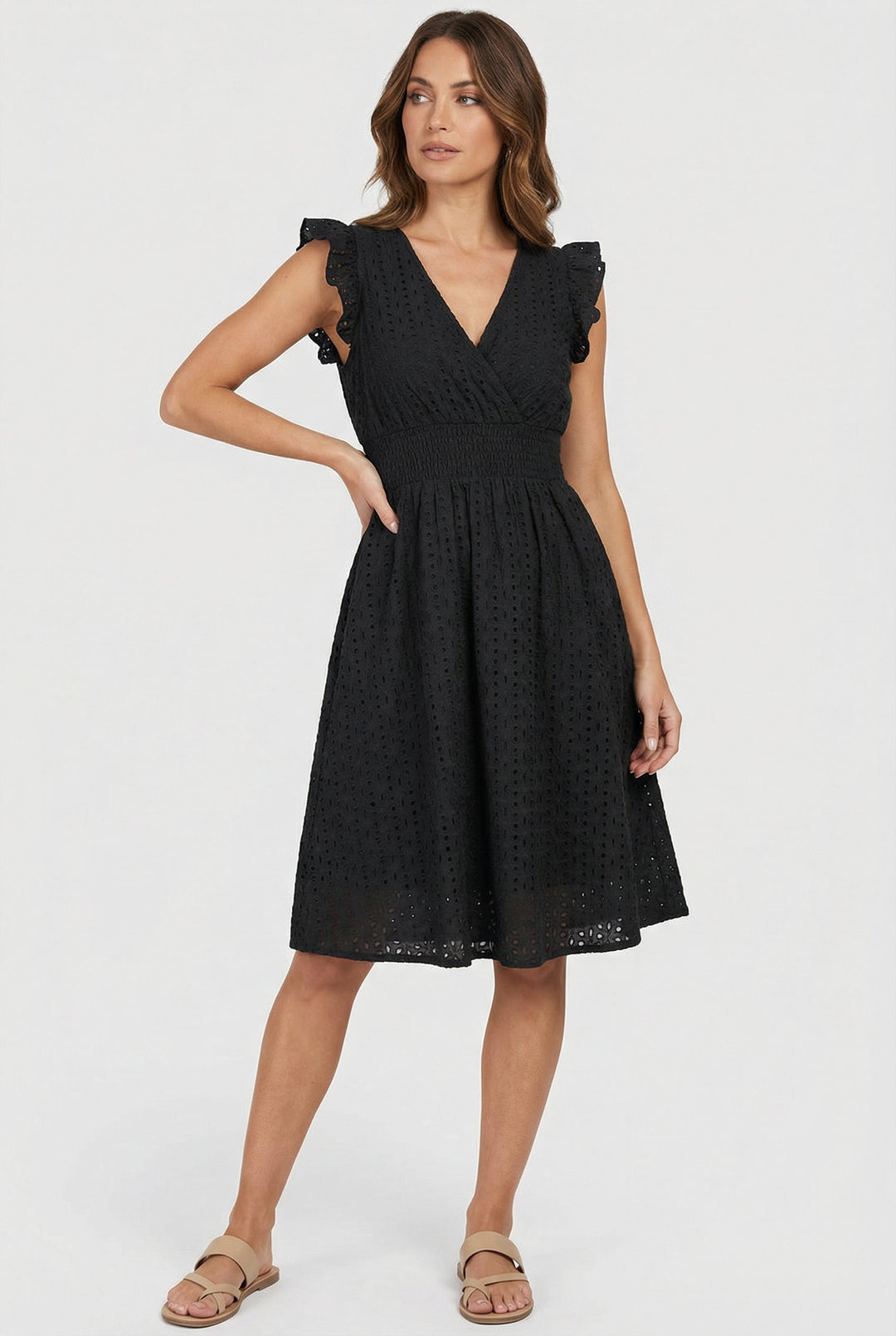 Stylish women's flared eyelet midi dress with ruffled sleeves & smocked waist, comfortable for casual summer wear.