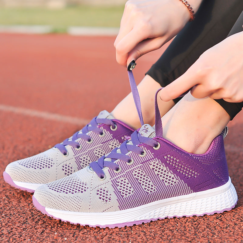 Breathable lace-up women's athletic walking shoes, supportive for everyday wear & comfort.