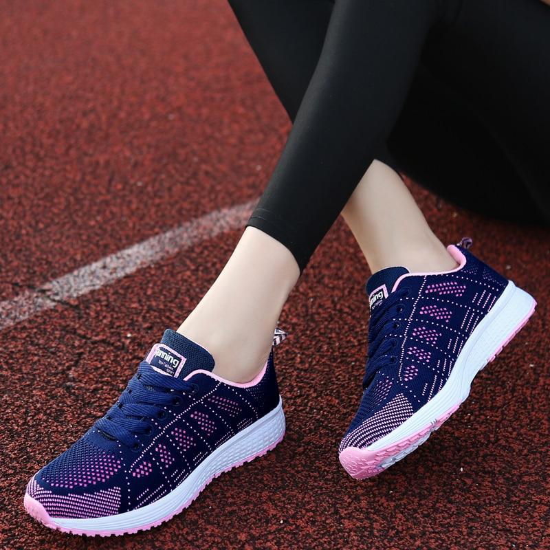 Women's lace-up walking shoes, offers stable arch support, comfortable fit, & everyday wear.