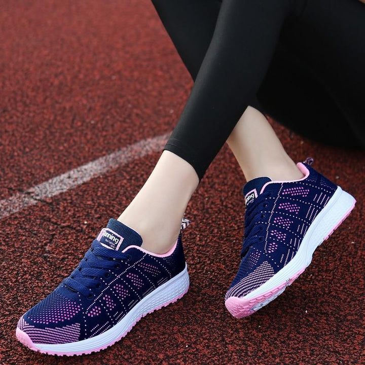 Women's lace-up walking shoes, offers stable arch support, comfortable fit, & everyday wear.