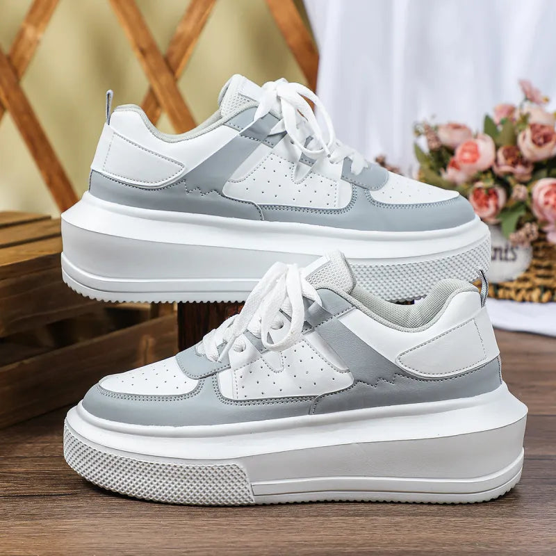 White perforated lace-up platform sneakers for women; a blend of casual, comfortable, and trendy footwear.
